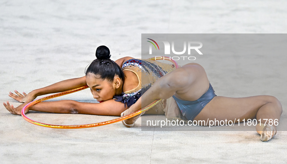 Aibota Yertaikyzy of Kazakhstan competes in the Hoop final of the International Rhythmic Gymnastics Tournament 'Sky Grace 2024' at Aspire Zo...