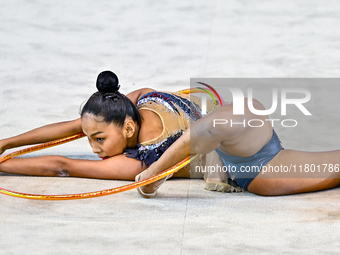 Aibota Yertaikyzy of Kazakhstan competes in the Hoop final of the International Rhythmic Gymnastics Tournament 'Sky Grace 2024' at Aspire Zo...