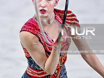 Takhmina Ikromova of Uzbekistan competes in the Hoop final of the International Rhythmic Gymnastics Tournament ''Sky Grace 2024'' at Aspire...