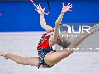 Takhmina Ikromova of Uzbekistan competes in the Hoop final of the International Rhythmic Gymnastics Tournament ''Sky Grace 2024'' at Aspire...