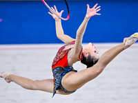 Takhmina Ikromova of Uzbekistan competes in the Hoop final of the International Rhythmic Gymnastics Tournament ''Sky Grace 2024'' at Aspire...