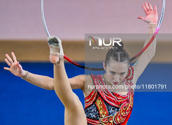 Takhmina Ikromova of Uzbekistan competes in the Hoop final of the International Rhythmic Gymnastics Tournament ''Sky Grace 2024'' at Aspire...