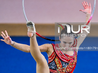 Takhmina Ikromova of Uzbekistan competes in the Hoop final of the International Rhythmic Gymnastics Tournament ''Sky Grace 2024'' at Aspire...