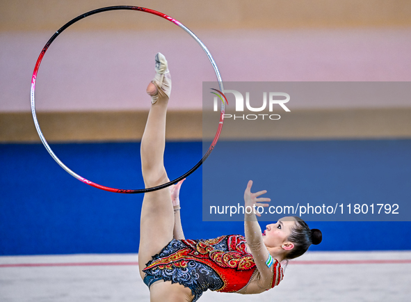 Takhmina Ikromova of Uzbekistan competes in the Hoop final of the International Rhythmic Gymnastics Tournament ''Sky Grace 2024'' at Aspire...