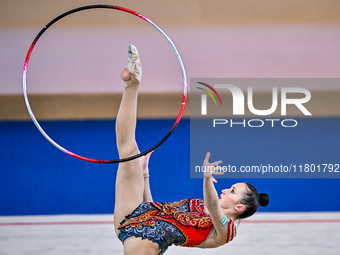 Takhmina Ikromova of Uzbekistan competes in the Hoop final of the International Rhythmic Gymnastics Tournament ''Sky Grace 2024'' at Aspire...