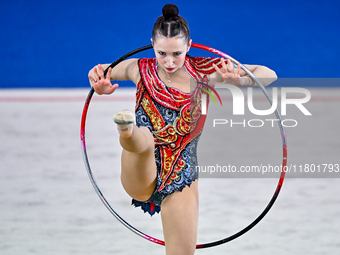 Takhmina Ikromova of Uzbekistan competes in the Hoop final of the International Rhythmic Gymnastics Tournament ''Sky Grace 2024'' at Aspire...