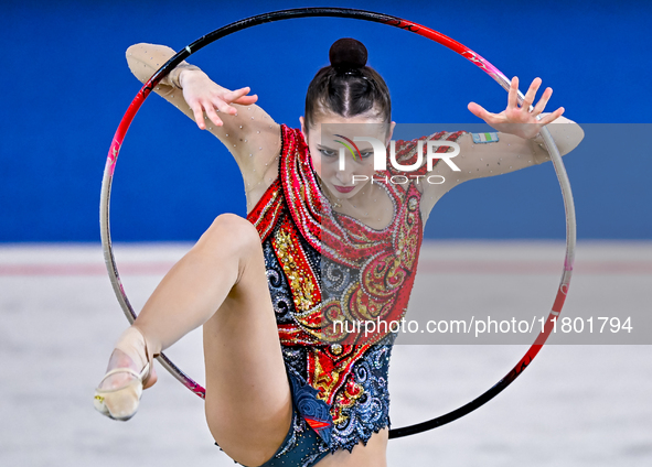 Takhmina Ikromova of Uzbekistan competes in the Hoop final of the International Rhythmic Gymnastics Tournament ''Sky Grace 2024'' at Aspire...