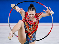 Takhmina Ikromova of Uzbekistan competes in the Hoop final of the International Rhythmic Gymnastics Tournament ''Sky Grace 2024'' at Aspire...