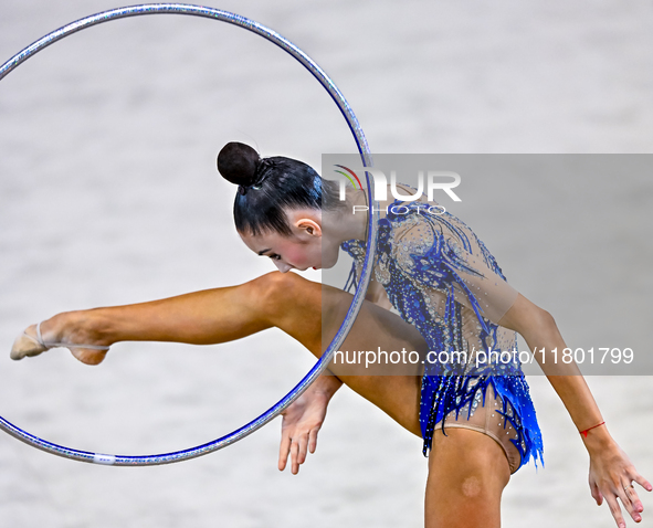 Polina Frolova of Russia competes in the Hoop final of the International Rhythmic Gymnastics Tournament ''Sky Grace 2024'' at Aspire Zone Fo...