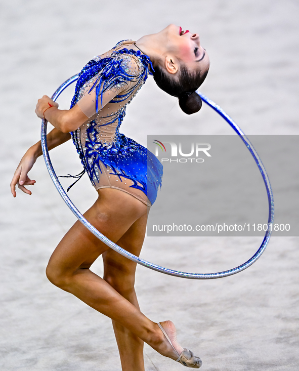 Polina Frolova of Russia competes in the Hoop final of the International Rhythmic Gymnastics Tournament ''Sky Grace 2024'' at Aspire Zone Fo...