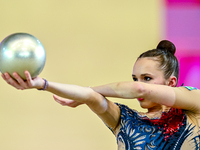 Takhmina Ikromova of Uzbekistan competes in the Ball final of the International Rhythmic Gymnastics Tournament ''Sky Grace 2024'' at Aspire...