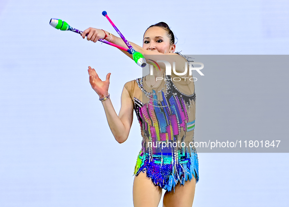 Takhmina Ikromova of Uzbekistan competes in the Clubs final of the International Rhythmic Gymnastics Tournament ''Sky Grace 2024'' at Aspire...