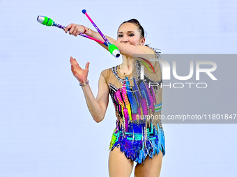 Takhmina Ikromova of Uzbekistan competes in the Clubs final of the International Rhythmic Gymnastics Tournament ''Sky Grace 2024'' at Aspire...