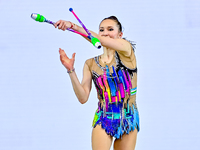 Takhmina Ikromova of Uzbekistan competes in the Clubs final of the International Rhythmic Gymnastics Tournament ''Sky Grace 2024'' at Aspire...