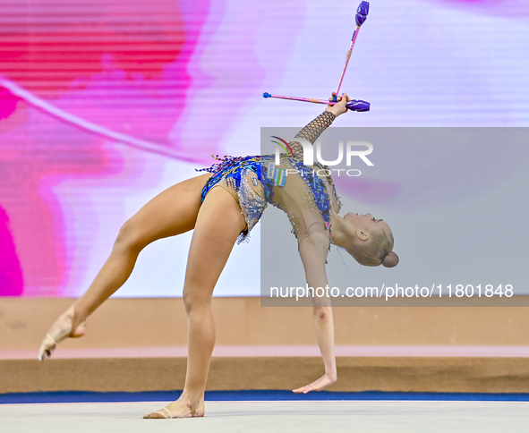 Natalya Usova of Uzbekistan competes in the Clubs final of the International Rhythmic Gymnastics Tournament ''Sky Grace 2024'' at Aspire Zon...