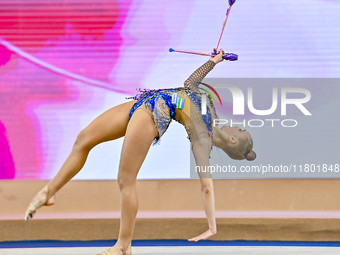 Natalya Usova of Uzbekistan competes in the Clubs final of the International Rhythmic Gymnastics Tournament ''Sky Grace 2024'' at Aspire Zon...