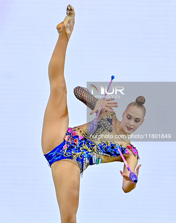 Natalya Usova of Uzbekistan competes in the Clubs final of the International Rhythmic Gymnastics Tournament ''Sky Grace 2024'' at Aspire Zon...