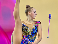 Natalya Usova of Uzbekistan competes in the Clubs final of the International Rhythmic Gymnastics Tournament ''Sky Grace 2024'' at Aspire Zon...