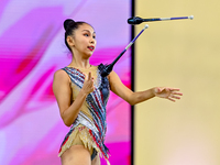 Aibota Yertaikyzy of Kazakhstan competes in the Clubs final of the International Rhythmic Gymnastics Tournament 'Sky Grace 2024' at Aspire Z...