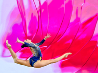 Alina Harnasko of Belarus competes in the Clubs final of the International Rhythmic Gymnastics Tournament 'Sky Grace 2024' at Aspire Zone Fo...