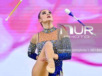 Alina Harnasko of Belarus competes in the Clubs final of the International Rhythmic Gymnastics Tournament 'Sky Grace 2024' at Aspire Zone Fo...