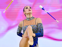 Alina Harnasko of Belarus competes in the Clubs final of the International Rhythmic Gymnastics Tournament 'Sky Grace 2024' at Aspire Zone Fo...