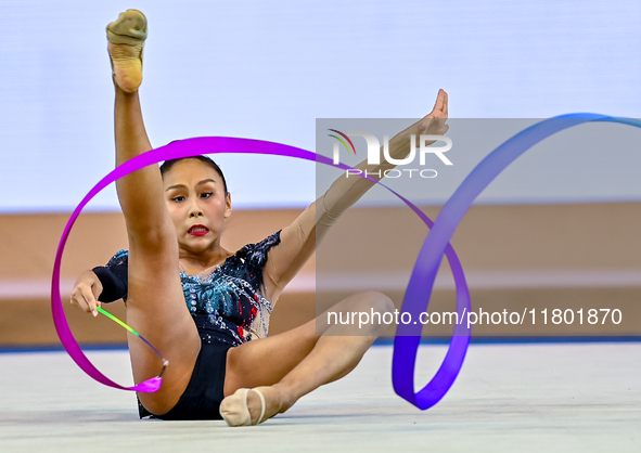 Aibota Yertaikyzy of Kazakhstan competes in the Ribbon final of the International Rhythmic Gymnastics Tournament ''Sky Grace 2024'' at Aspir...