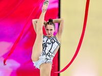 Takhmina Ikromova of Uzbekistan competes in the Ribbon final of the International Rhythmic Gymnastics Tournament 'Sky Grace 2024' at Aspire...