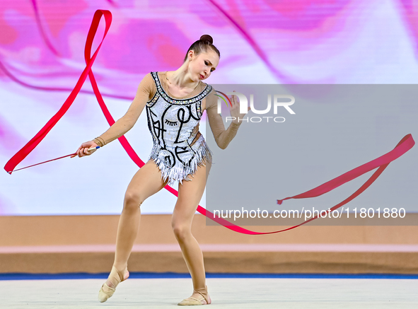 Takhmina Ikromova of Uzbekistan competes in the Ribbon final of the International Rhythmic Gymnastics Tournament 'Sky Grace 2024' at Aspire...