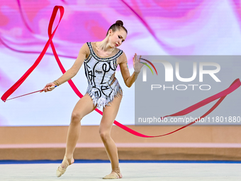 Takhmina Ikromova of Uzbekistan competes in the Ribbon final of the International Rhythmic Gymnastics Tournament 'Sky Grace 2024' at Aspire...