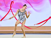 Takhmina Ikromova of Uzbekistan competes in the Ribbon final of the International Rhythmic Gymnastics Tournament 'Sky Grace 2024' at Aspire...