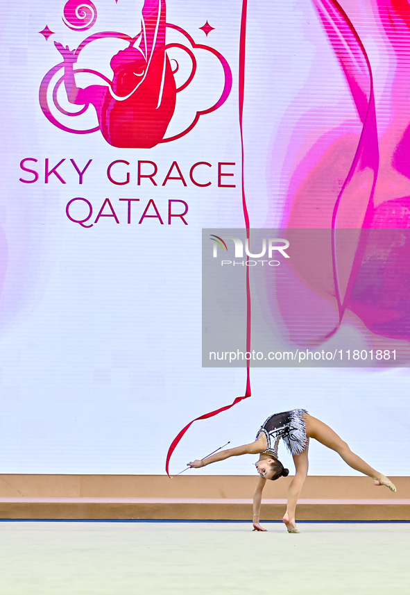 Takhmina Ikromova of Uzbekistan competes in the Ribbon final of the International Rhythmic Gymnastics Tournament 'Sky Grace 2024' at Aspire...