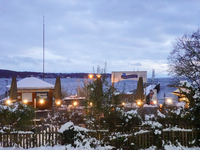 A view of the waterfront promenade at Lake Starnberg on November 22, 2024. Snow covers the ticket booth of the Bayerische Seenschifffahrt Gm...