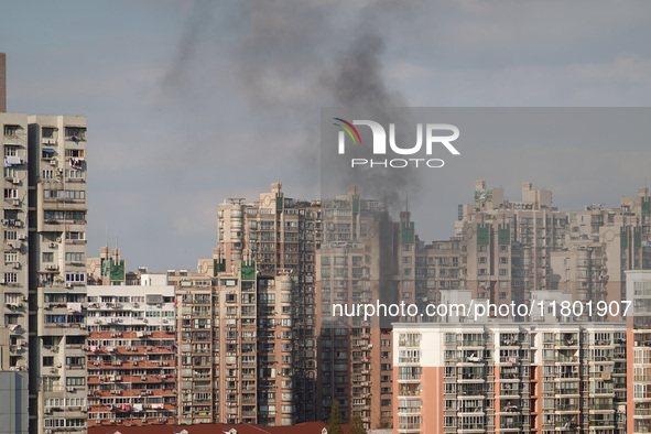 A fire breaks out in a residential area in Shanghai, China, on November 23, 2024. 