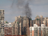 A fire breaks out in a residential area in Shanghai, China, on November 23, 2024. (