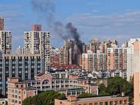 A fire breaks out in a residential area in Shanghai, China, on November 23, 2024. (