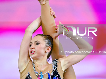 Takhmina Ikromova of Uzbekistan competes in the Clubs final of the International Rhythmic Gymnastics Tournament ''Sky Grace 2024'' at Aspire...