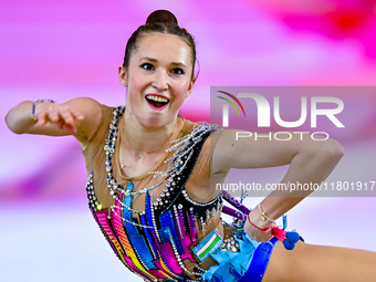 Takhmina Ikromova of Uzbekistan competes in the Clubs final of the International Rhythmic Gymnastics Tournament ''Sky Grace 2024'' at Aspire...