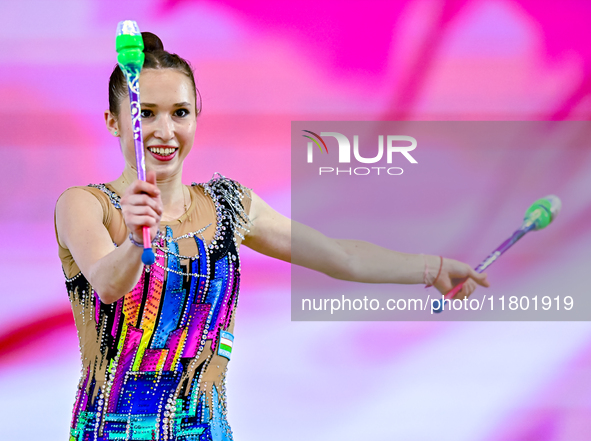 Takhmina Ikromova of Uzbekistan competes in the Clubs final of the International Rhythmic Gymnastics Tournament ''Sky Grace 2024'' at Aspire...