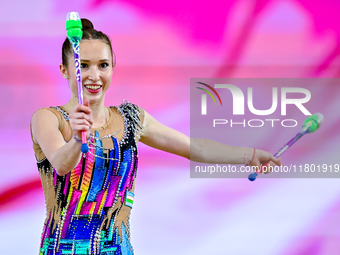 Takhmina Ikromova of Uzbekistan competes in the Clubs final of the International Rhythmic Gymnastics Tournament ''Sky Grace 2024'' at Aspire...