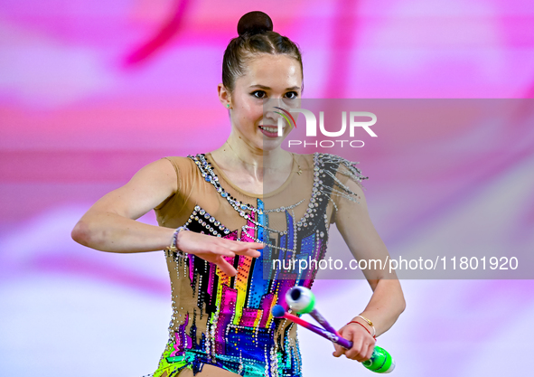 Takhmina Ikromova of Uzbekistan competes in the Clubs final of the International Rhythmic Gymnastics Tournament ''Sky Grace 2024'' at Aspire...