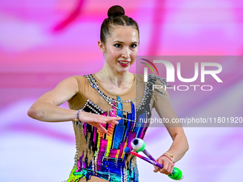 Takhmina Ikromova of Uzbekistan competes in the Clubs final of the International Rhythmic Gymnastics Tournament ''Sky Grace 2024'' at Aspire...