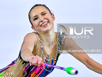 Takhmina Ikromova of Uzbekistan competes in the Clubs final of the International Rhythmic Gymnastics Tournament ''Sky Grace 2024'' at Aspire...