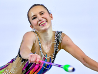 Takhmina Ikromova of Uzbekistan competes in the Clubs final of the International Rhythmic Gymnastics Tournament ''Sky Grace 2024'' at Aspire...