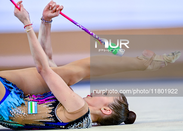 Takhmina Ikromova of Uzbekistan competes in the Clubs final of the International Rhythmic Gymnastics Tournament ''Sky Grace 2024'' at Aspire...