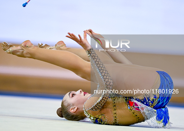 Natalya Usova of Uzbekistan competes in the Clubs final of the International Rhythmic Gymnastics Tournament ''Sky Grace 2024'' at Aspire Zon...