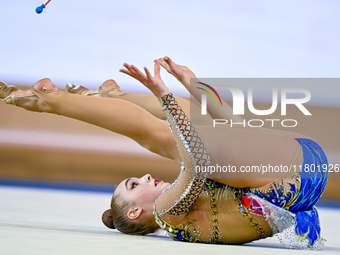 Natalya Usova of Uzbekistan competes in the Clubs final of the International Rhythmic Gymnastics Tournament ''Sky Grace 2024'' at Aspire Zon...