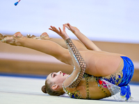 Natalya Usova of Uzbekistan competes in the Clubs final of the International Rhythmic Gymnastics Tournament ''Sky Grace 2024'' at Aspire Zon...