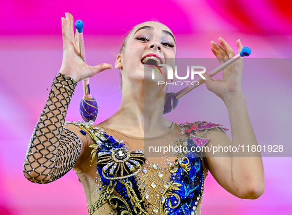 Natalya Usova of Uzbekistan competes in the Clubs final of the International Rhythmic Gymnastics Tournament ''Sky Grace 2024'' at Aspire Zon...