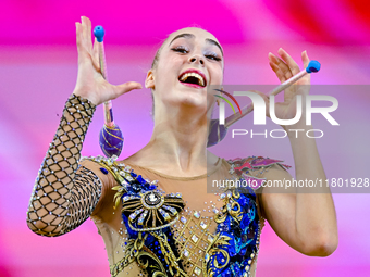 Natalya Usova of Uzbekistan competes in the Clubs final of the International Rhythmic Gymnastics Tournament ''Sky Grace 2024'' at Aspire Zon...